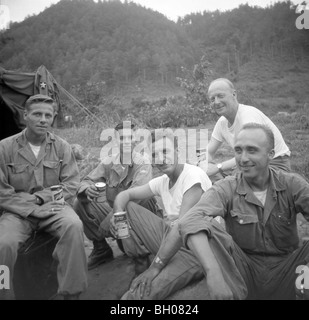 Officers of the Second Infantry Division relax for a group photo while drinking their beer ration in a break from Korean War. Stock Photo