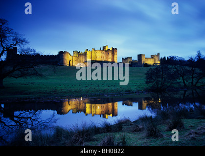 Alnwick Castle in Northumberland, England, floodlit at night Stock Photo