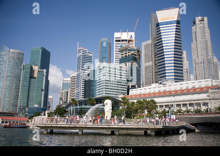 Singapore. Merlion fountain on waterfront with city buildings in background. Stock Photo
