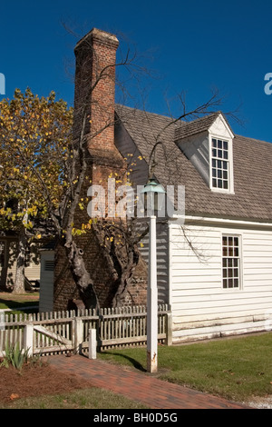 Stock photo of small house with large traditional chimney in Colonial Williamsburg, VA, USA. Stock Photo