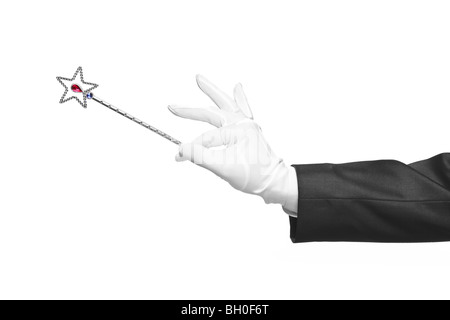 Hand holding a magic wand, isolated on white background Stock Photo