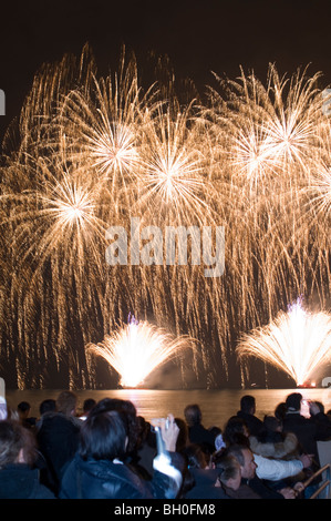Nice, France, Crowd Watching Carnival Fireworks over Mediterranean Sea Night, Beach Stock Photo