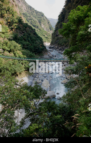 View of the suspension bridge at Taroko National Park with metal ...