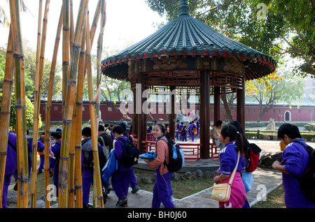 School class walking through park to Koxinga's shrine, Tainan, Taiwan, Asia Stock Photo