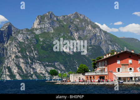 View over lake Garda to pavement cafe at promenade, Nago-Torbole, Trentino-Alto Adige, Suedtirol, Italy Stock Photo