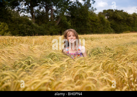 Close up of Girl in Wheat Field in Lincolnshire,England,GB Stock Photo