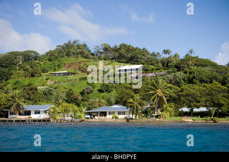 Houses at the coastline in the sunlight, Raiatea, Society Islands, French Polynesia, South Pacific, Oceania Stock Photo