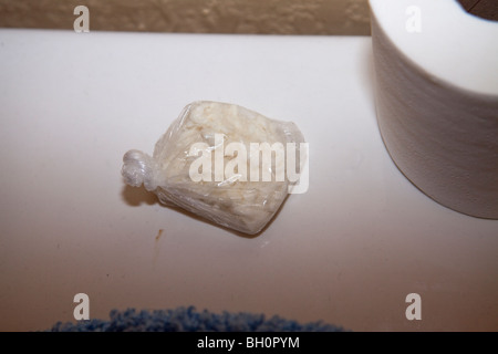 Narcotics found in bathroom. Narcotics related search warrant. Crack cocaine. Stock Photo