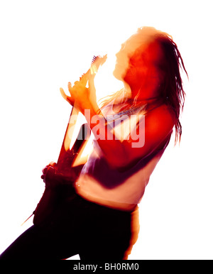 blurred colour picture of a rock guitarist playing enthusiastically Stock Photo