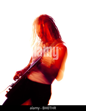 blurred colour picture of a rock guitarist playing enthusiastically Stock Photo