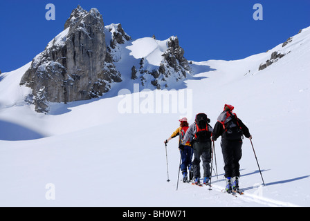 Three backcountry skiers ascending, Tajatoerl, Mieminger range, Tyrol, Austria Stock Photo