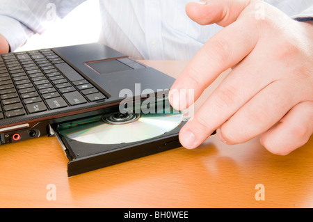 Disk in the disk drive of a computer. Stock Photo