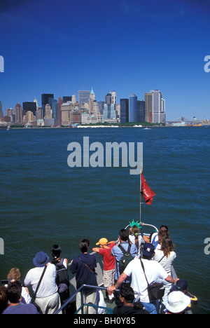 Tourists in Ferry Looking at Manhattan Skyline, NYC Stock Photo