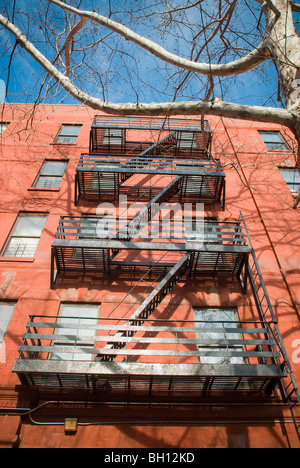 Apartment building exterior with windows and fire escapes New York City ...
