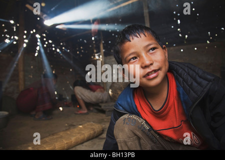 Smiling boy in a cook shack, Pokhara, Nepal Stock Photo
