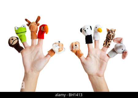 Female hand wearing 10 finger puppets; monkey, frog, reindeer, parrot; lion; bear; panda; duck; giraffe; elephant Stock Photo