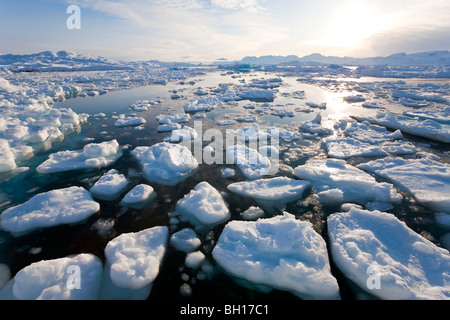 Tiniteqilaq and sea ice in fjord, E. Greenland Stock Photo