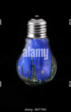 Lightning during thunderstorm above petrochemical industry inside incandescent lamp / bulb against black background Stock Photo