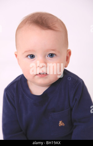 6 month old red haired baby boy sitting Stock Photo - Alamy