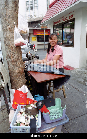 Tailor working on street, Bangkok, Thailand Stock Photo