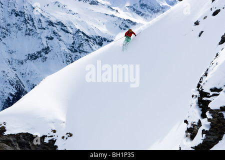 Domaine de Freeride, Zinal, A young man skiing in powder snow, canton Valais, Wallis, Switzerland, Alps, MR Stock Photo