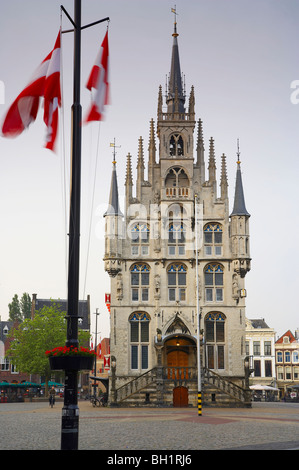 Flags in front of the gothic town hall at the market place at the Old Town, Gouda, Netherlands, Europe Stock Photo
