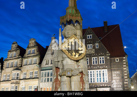 Market square in Bremen at night with Roland statue and town houses, [The city was accepted as a World Heritage Site by UNESCO], Stock Photo