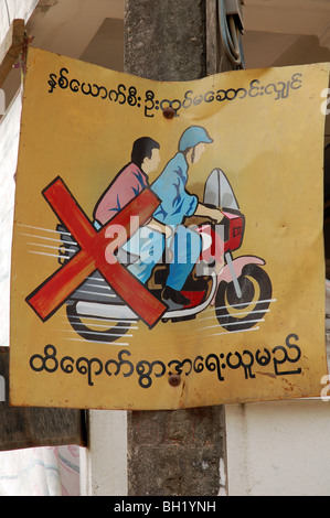 Burmese road signs and banners in Tachileik, MYANMAR Stock Photo