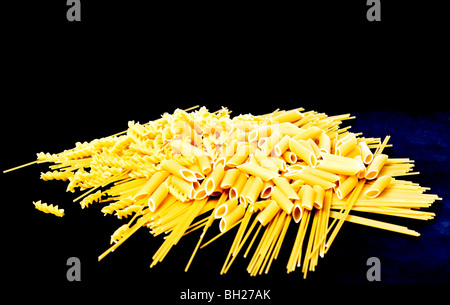 Pasta composition different shapes on black background Stock Photo