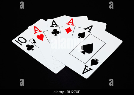 Playing cards showing a Four of a Kind poker hand with aces Stock Photo