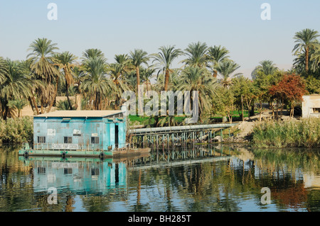 RIVER NILE, UPPER EGYPT. A Japanese-sponsored floating mobile pump station, supplying water to fields in the Nile Valley. Stock Photo