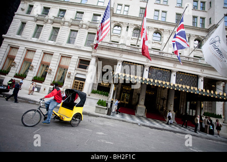 The Plaza Hotel as seen from the corner of 5th Avenue  in Manhattan with a tricycle waiting before the entrance Stock Photo