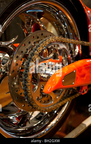 Rear wheel of an chain drive motor bike Stock Photo