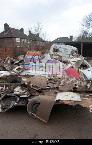 caravan caravans smashed up old vans camping camper campervans camp site sites campsite campsite rubbish bad tip tips pit pits c Stock Photo