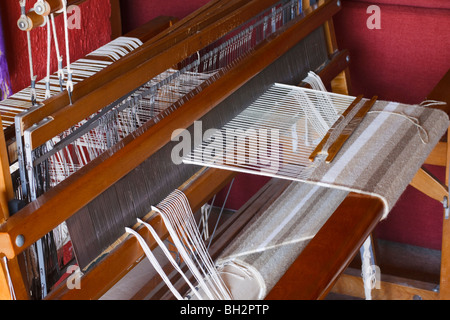 Woollen rug being hand woven on a wooden loom. Kwazulu Natal, South Africa. Stock Photo