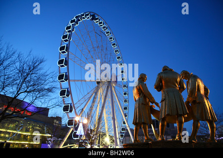 Boulton Watt and Murdoch statue in Centenary square with the Big wheel in Birmingham., Stock Photo