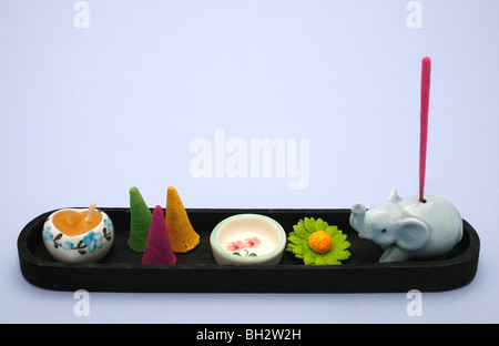 Still life of incense sticks, cones and ceramic holders Stock Photo