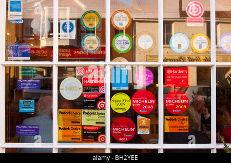Restaurant guide award stickers in a chinese restaurant window Stock ...