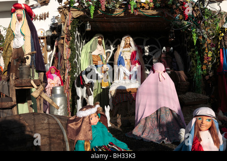 A crib or nativity scene set with mannequins and rustic props in a garden in Tamaimo Tenerife Canary Islands Spain Stock Photo