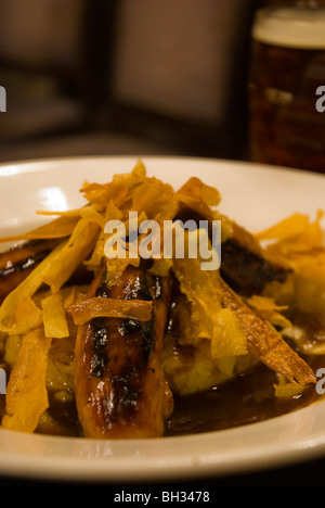 Cumberland sausages with parsnip crisps and mash in Bank pub Manchester England UK Europe Stock Photo