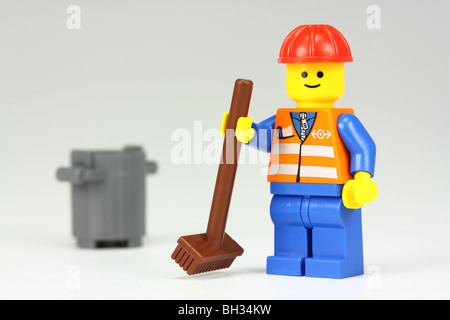 Lego janitor with brush and bin Stock Photo