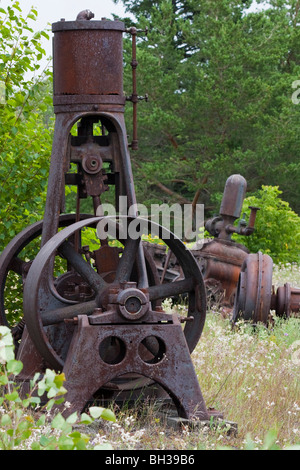 Mining equipment Quincy Mine Hancock Upper Peninsula Michigan MI in USA US the rusty machines in foreground close up pictures images vertical hi-res Stock Photo