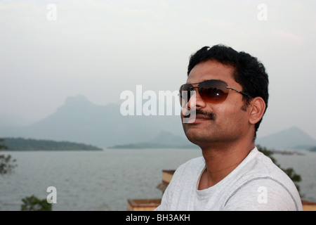 Stylish Pose of an Indian Young Man with sunglasses Stock Photo