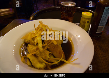 Bangers and mash with gravy and parsnip crisps Brighton England UK Europe Stock Photo