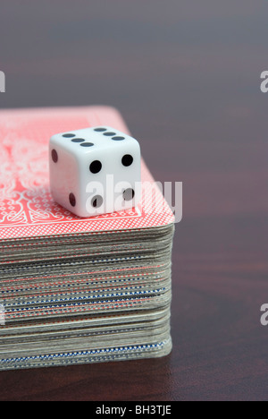 dice on playing cards pack Stock Photo