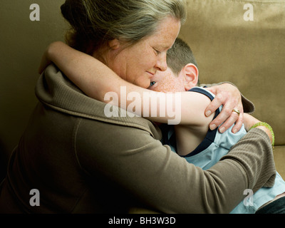 A mum hugging her son Stock Photo