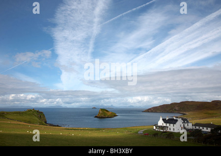 Tulm bay with Tulm castle, Duntulm hotel and the mountains of Harris in the distance. Stock Photo