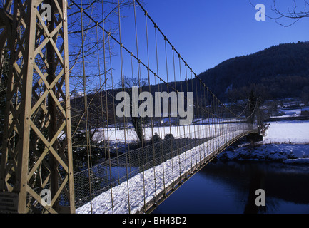 Suspension Bridge over river Conwy in snow Betws-y-Coed Conwy County North Wales UK Stock Photo