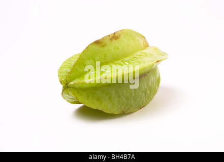 Unripe Asian Star Fruit isolated against white background. Stock Photo