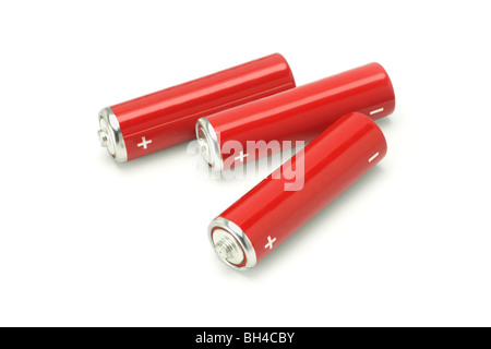 Three red AA size batteries on white background Stock Photo